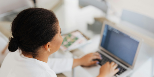 Woman working on laptop - email hours